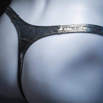 Men's metallic dark silver thong, slim cut, angled rear view.