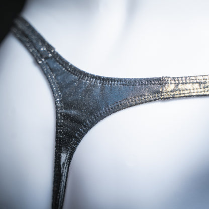 Men's metallic dark silver thong, slim cut, closeup rear view.