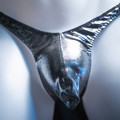 Men's metallic dark silver thong, slim cut, closeup front view.