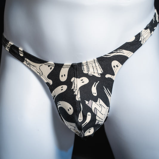Men's Halloween thong featuring white ghosts, slim cut, front view.