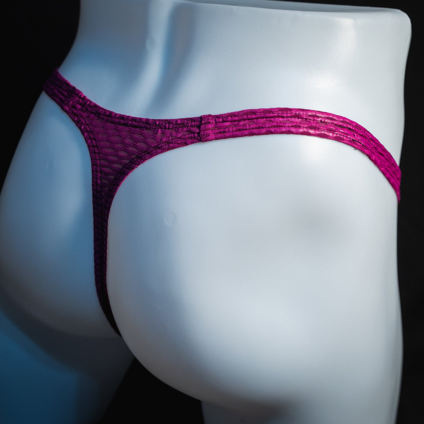 handmade mens thong underwear, plump purple print, yoga mesh material, classic cut variation, angled back view