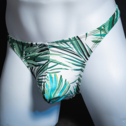 Men's tropical palm leaves thong, classic cut, angled front view.