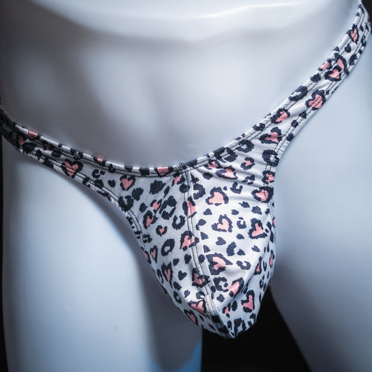 Men's white cheetah with pink hearts thong, slim cut, front view.
