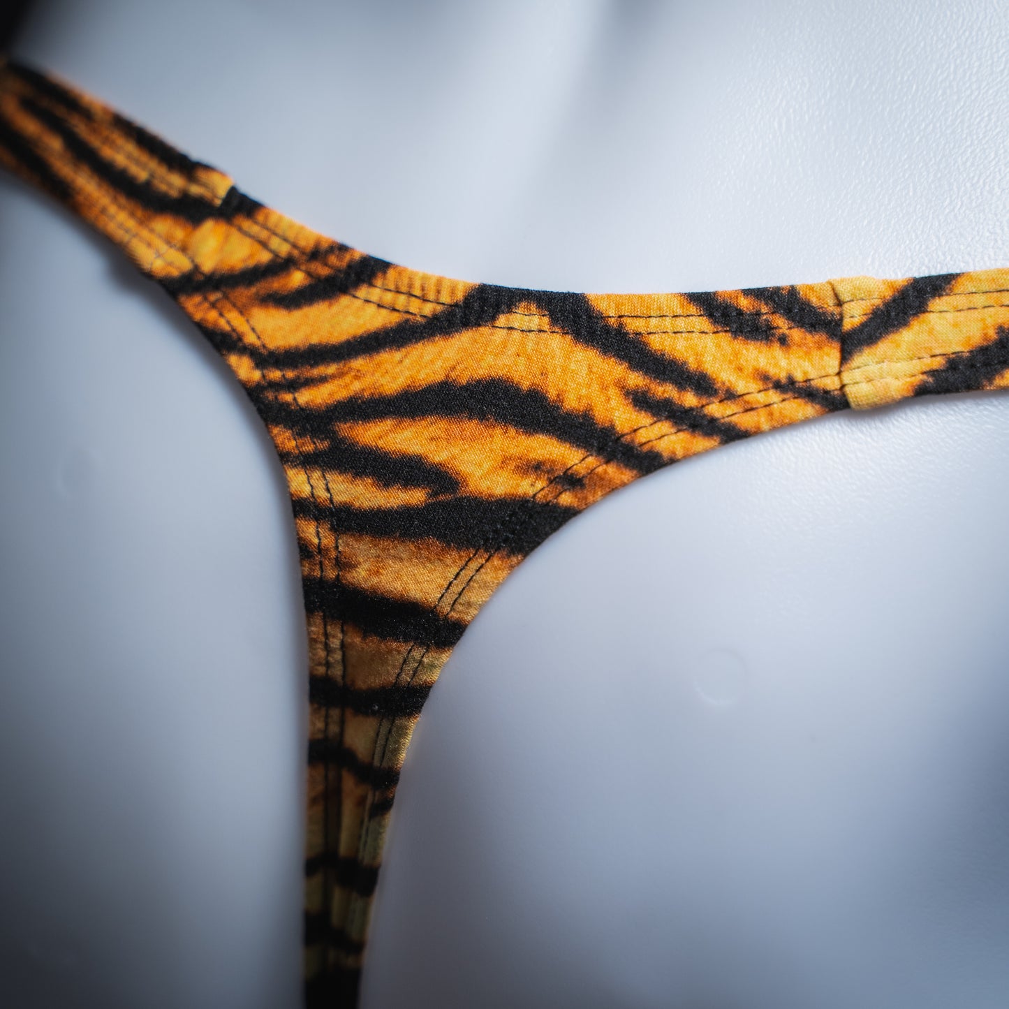 handmade mens thong underwear, tiger stripe print, soft polyester, close up angled back view