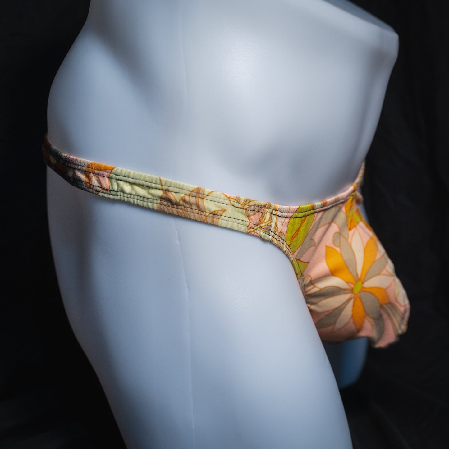 Men's vintage floral thong, classic cut, side view.