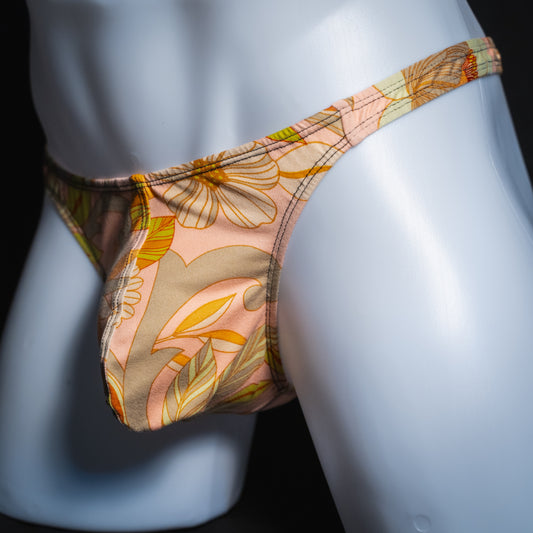 Men's vintage floral thong, classic cut, angled front view.