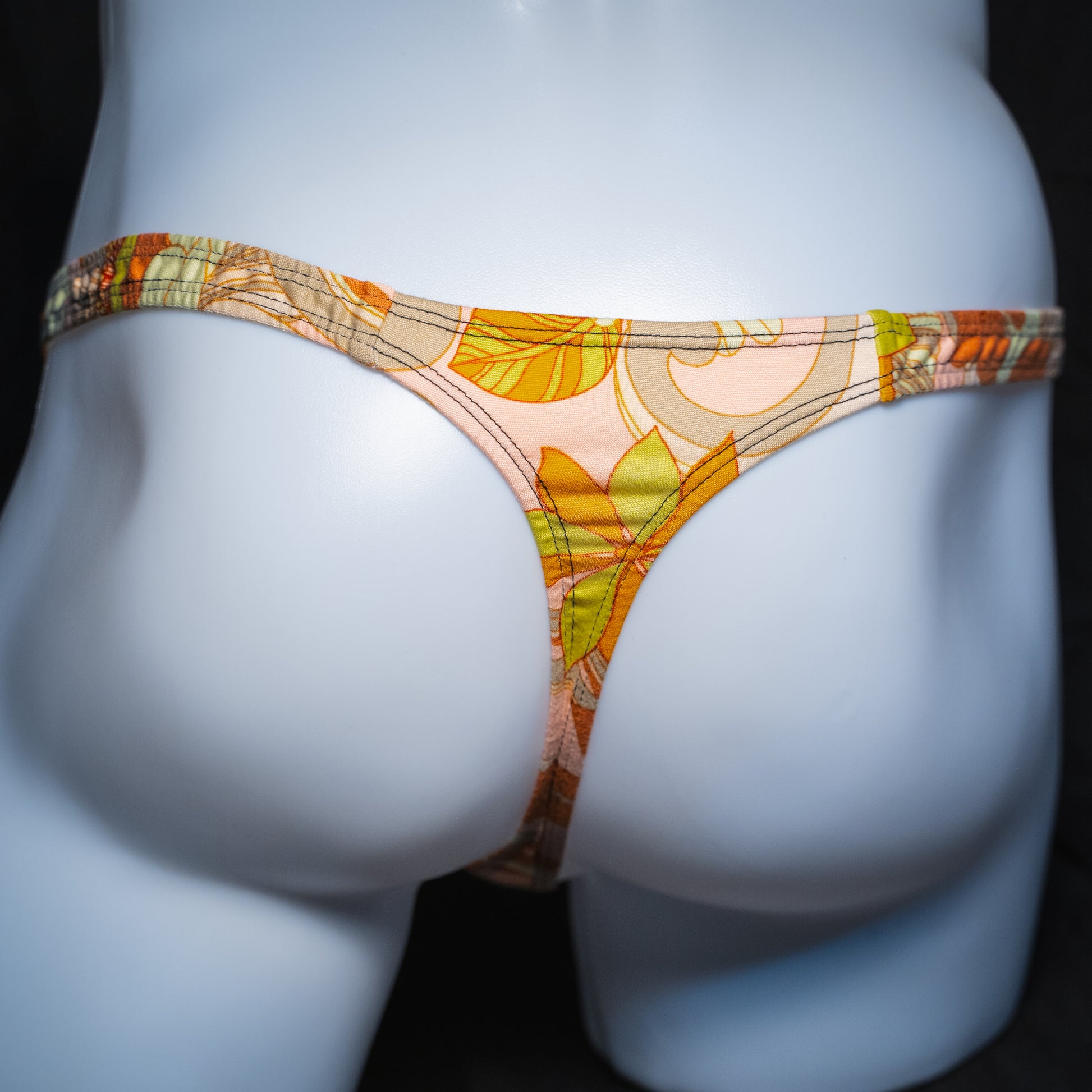 Men's vintage floral thong, classic cut, rear view.