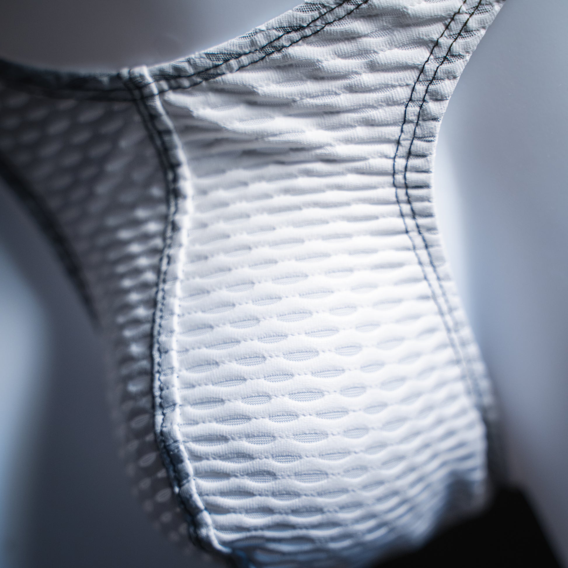 handmade mens thong underwear, white yoga mesh material, front view close up